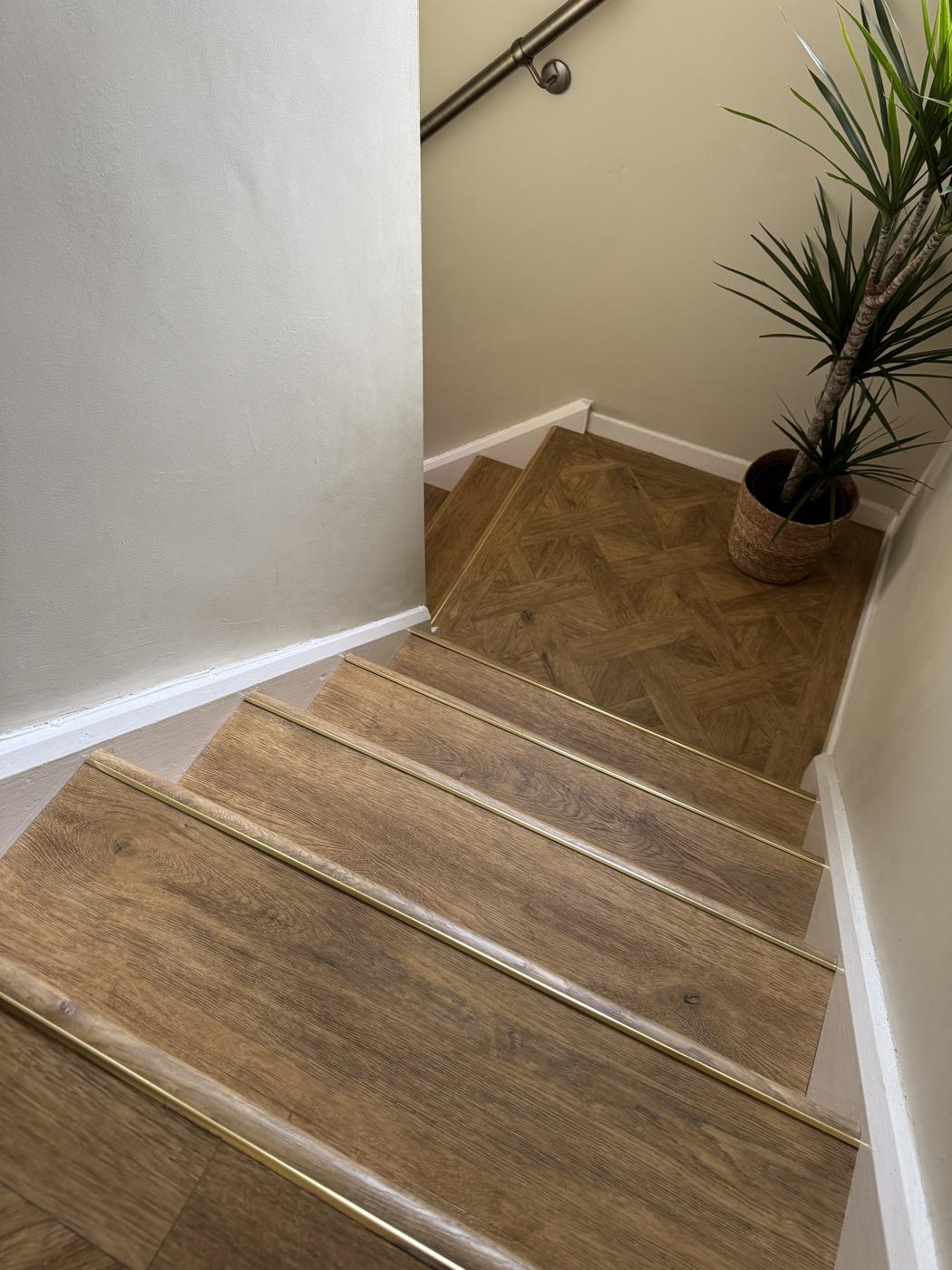 LVT staircase finished with brass stair nosings
