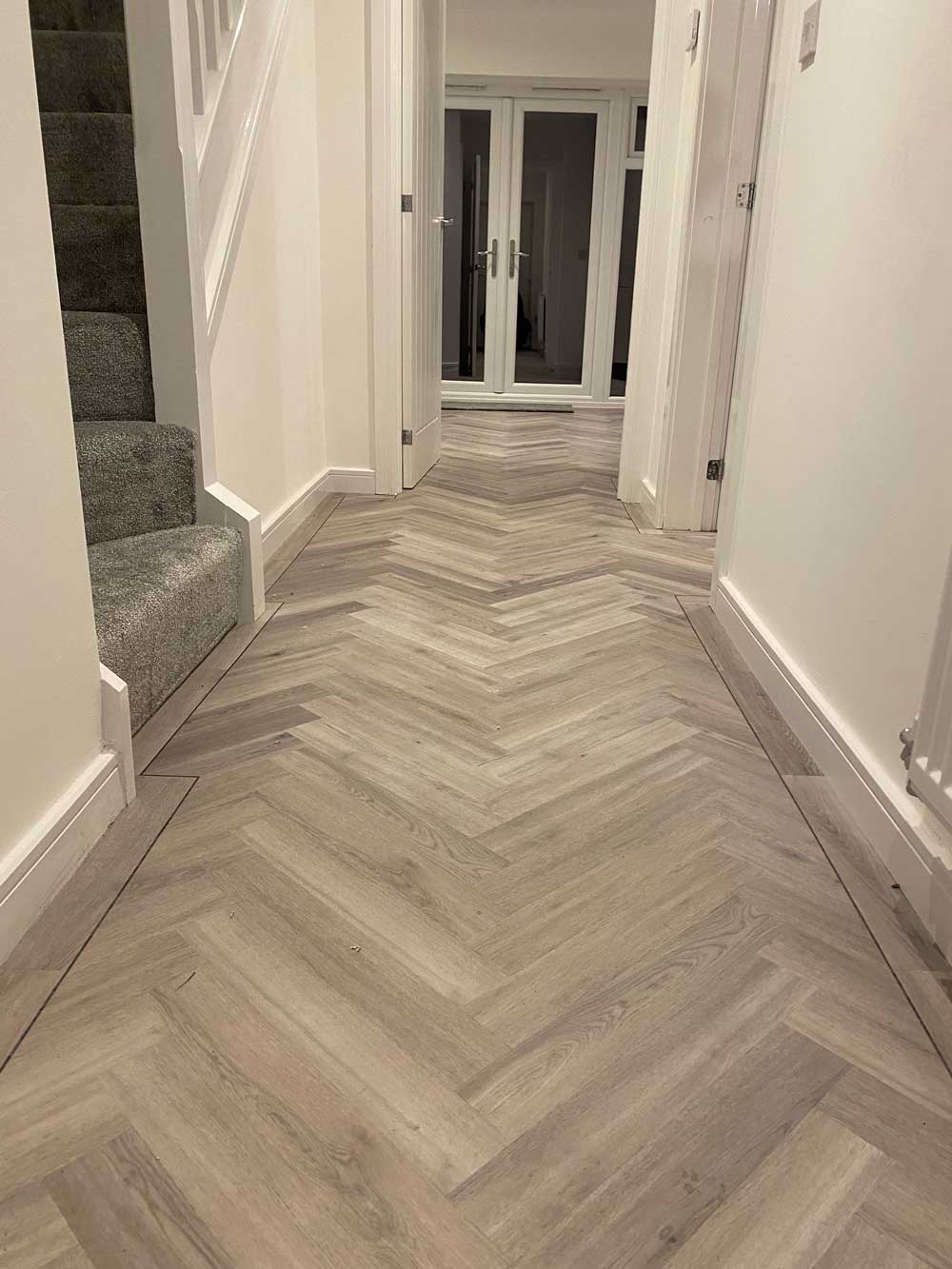 Grey herringbone hallway